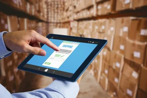 Composite image of man using tablet pc 스톡 사진