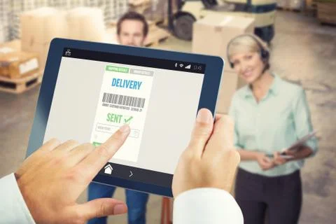 Composite image of man using tablet pc Stock Photos