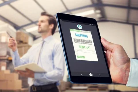 Composite image of man using tablet pc 스톡 사진