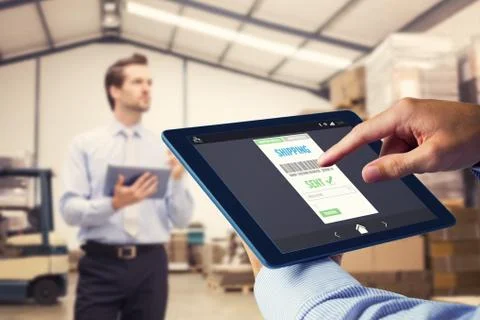 Composite image of man using tablet pc 스톡 사진