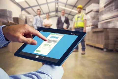 Composite image of man using tablet pc 스톡 사진