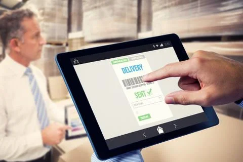 Composite image of man using tablet pc 스톡 사진