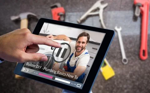 Composite image of man using tablet pc 写真素材