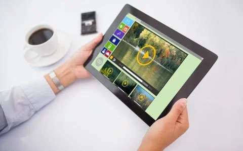 Composite image of man using tablet pc Stock Photos