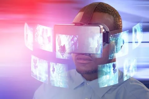 Composite image of man with virtual reality headset Stock Photos
