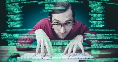 Composite image of man wearing eye glasses typing on computer keyboard Stock Photos