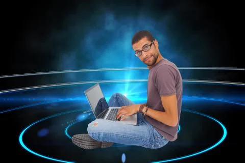 Composite image of man wearing glasses sitting on floor using laptop and looking Illustrazione stock