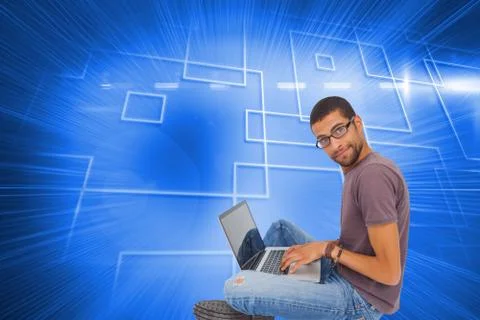 Composite image of man wearing glasses sitting on floor using laptop and looking Stock Illustration