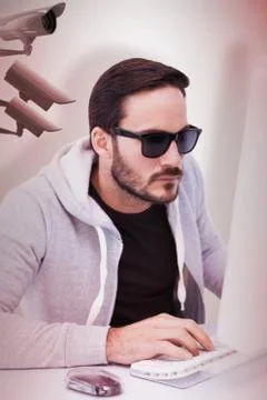Composite image of man wearing sunglasses hacking into laptop 스톡 일러스트