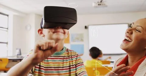 Composite image of math concept icons against caucasian boy wearing a vr headset Stock Photos