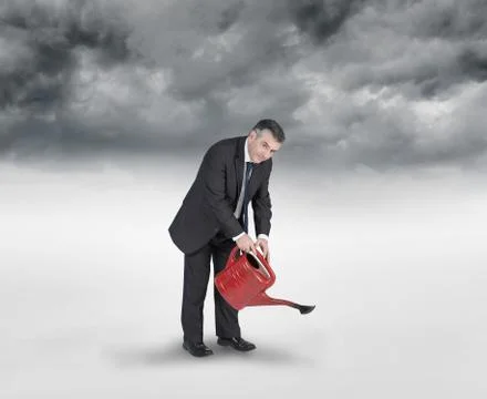 Composite image of mature businessman using watering can Stock Illustration