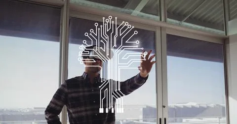 Composite image of microprocessor connections against caucasian man wearing vr 写真素材
