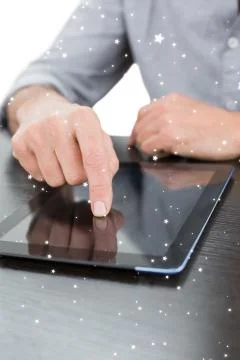 Composite image of mid section of a businessman using digital tablet at table イラスト素材