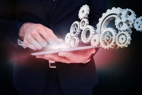 Composite image of mid section of a businessman touching digital tablet Illustrazione stock