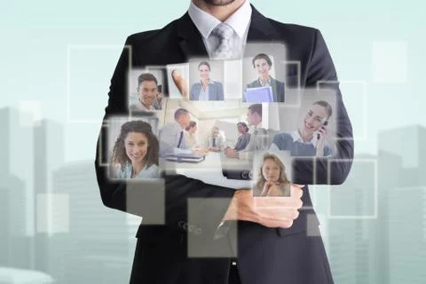 Composite image of mid section of businessman holding computer Illustrazione stock