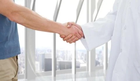 Composite image of mid section of a doctor and patient shaking hands Illustrazione stock