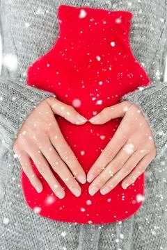 Composite image of mid section of a woman holding red hot water bag on abdomen Stock Illustration