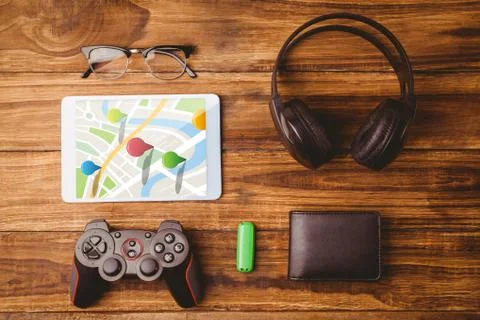 Composite image of multi colored navigation pointers on map Foto stock