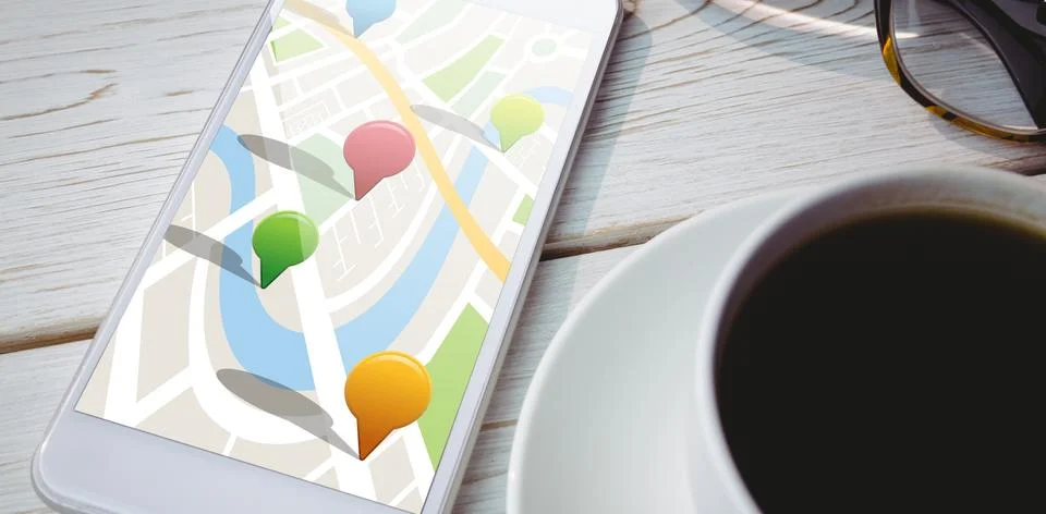 Composite image of multi colored navigation pointers on map Foto stock