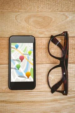 Composite image of multi colored navigation pointers on map Foto stock