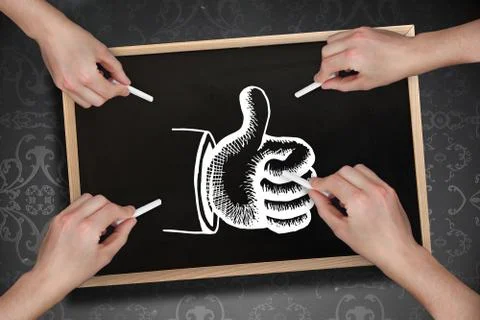 Composite image of multiple hands drawing thumb up with chalk Stock Photos