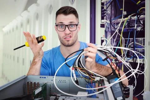 Composite image of portrait of confused it professional with screw driver and Stock Illustration