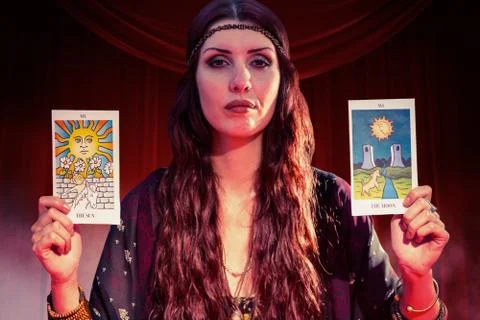 Composite image of portrait of fortune teller woman showing tarot cards Stock Photos