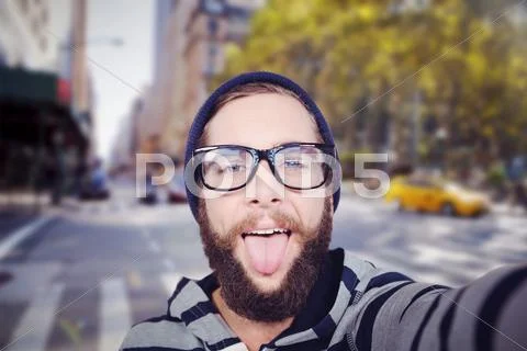 Composite Image Of Portrait Of Happy Hipster Sticking Out Tongue