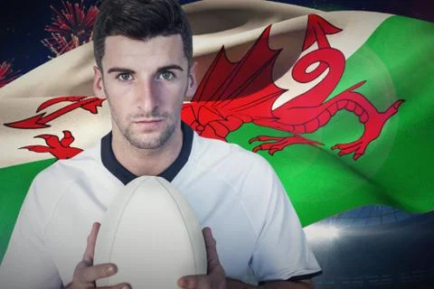 Composite image of portrait of a player holding rugby ball Stock Photos