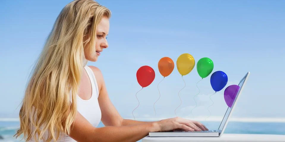Composite image of pretty blonde using her laptop at the beach Stock Illustration