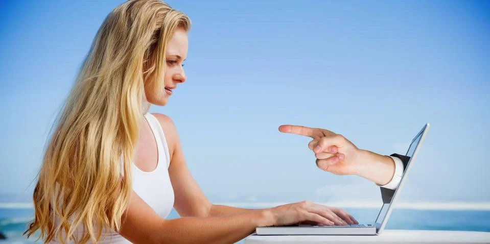 Composite image of pretty blonde using her laptop at the beach Stock Illustration