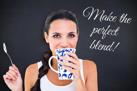 Composite image of pretty brunette having cup of tea Illustrazione stock