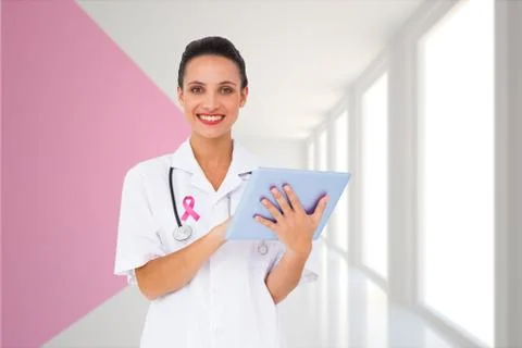 Composite image of pretty nurse using tablet pc Stock Photos