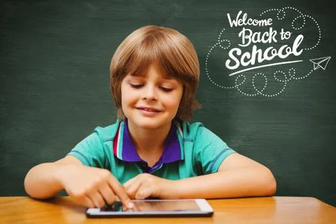 Composite image of pupil using tablet pc Stock Photos