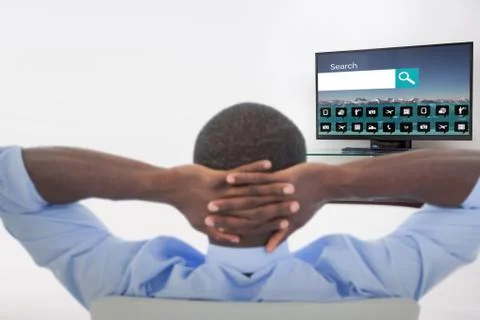 Composite image of rear view of man relaxing on chair Foto stock