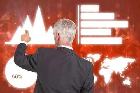 Composite image of rear view of stylish mature businessman pointing finger 库存照片