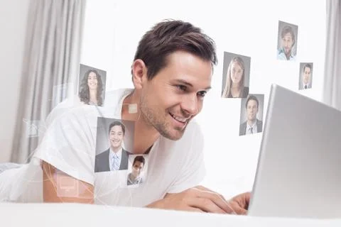 Composite image of relaxed casual man using laptop in bed Stock Illustration