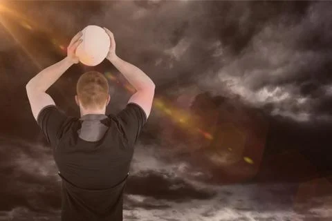 Composite image of rugby player about to throw a rugby ball 3D Stock Photos