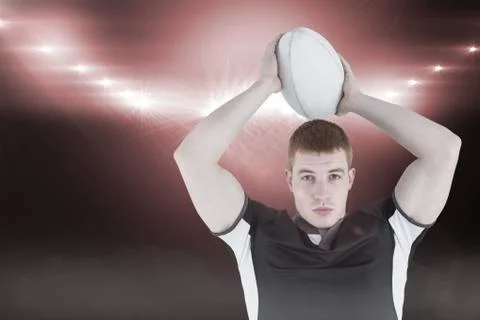 Composite image of rugby player about to throw a rugby ball 3D Stock Photos