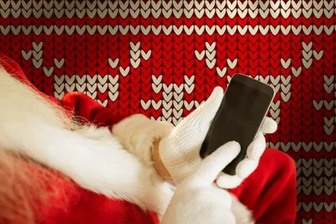 Composite image of santa using smartphone Stock Photos