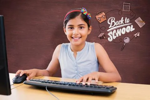 Composite image of school kid on computer Foto stock