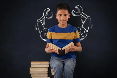 Composite image of schoolboy sitting on stack of books Fotos Stock
