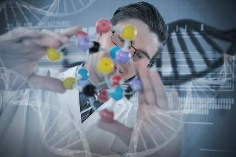 Composite image of scientist holding colorful molecule structure Stock Photos