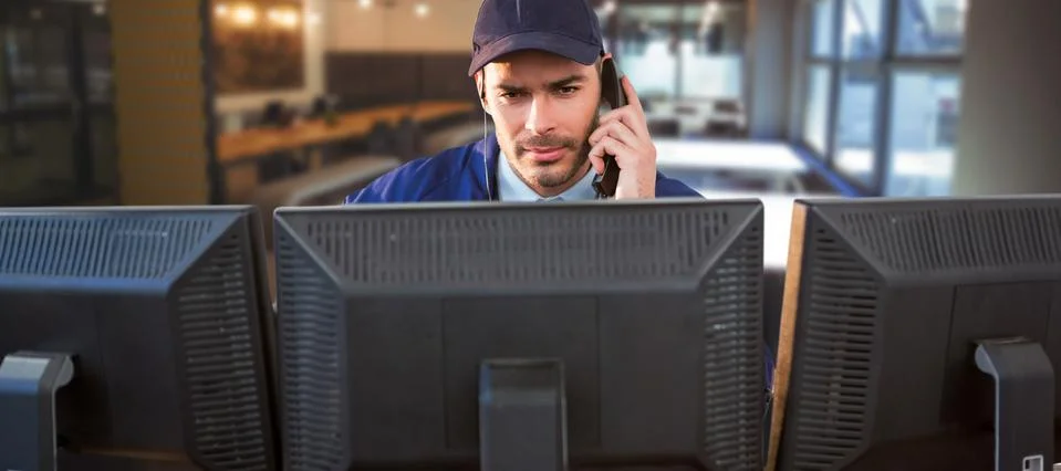 Composite image of security officer talking on phone while using computer at Stock Photos