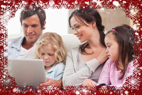 Composite image of serene family using a notebook Illustrazione stock