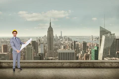 Composite image of serious architect with hard hat holding plans Illustrazione stock