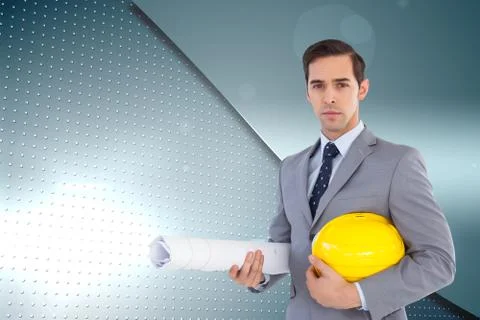 Composite image of serious architect holding plans and hard hat Illustrazione stock