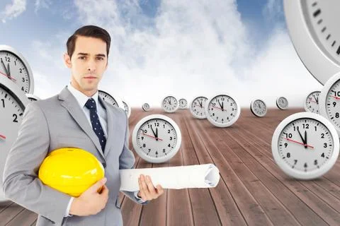 Composite image of serious architect holding plans and hard hat Illustrazione stock