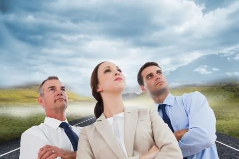 Composite image of serious work team posing together looking away 库存插图
