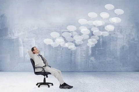 Composite image of side view of businessman leaning back in his chair Illustrazione stock